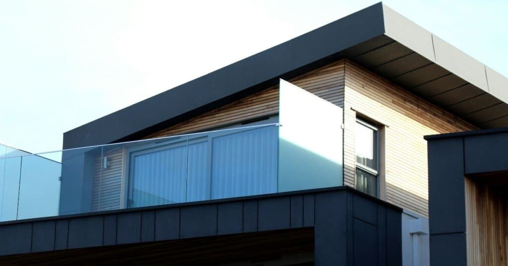 Modern house with black aluminum windows and a balcony